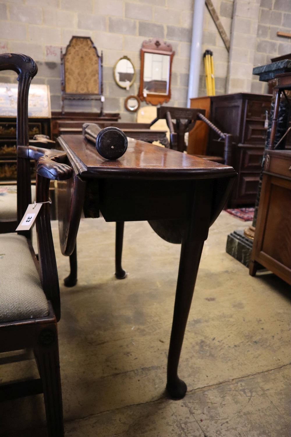 A George III crossbanded mahogany pad foot dining table, width 94cm 90cm (extended) height 70cm